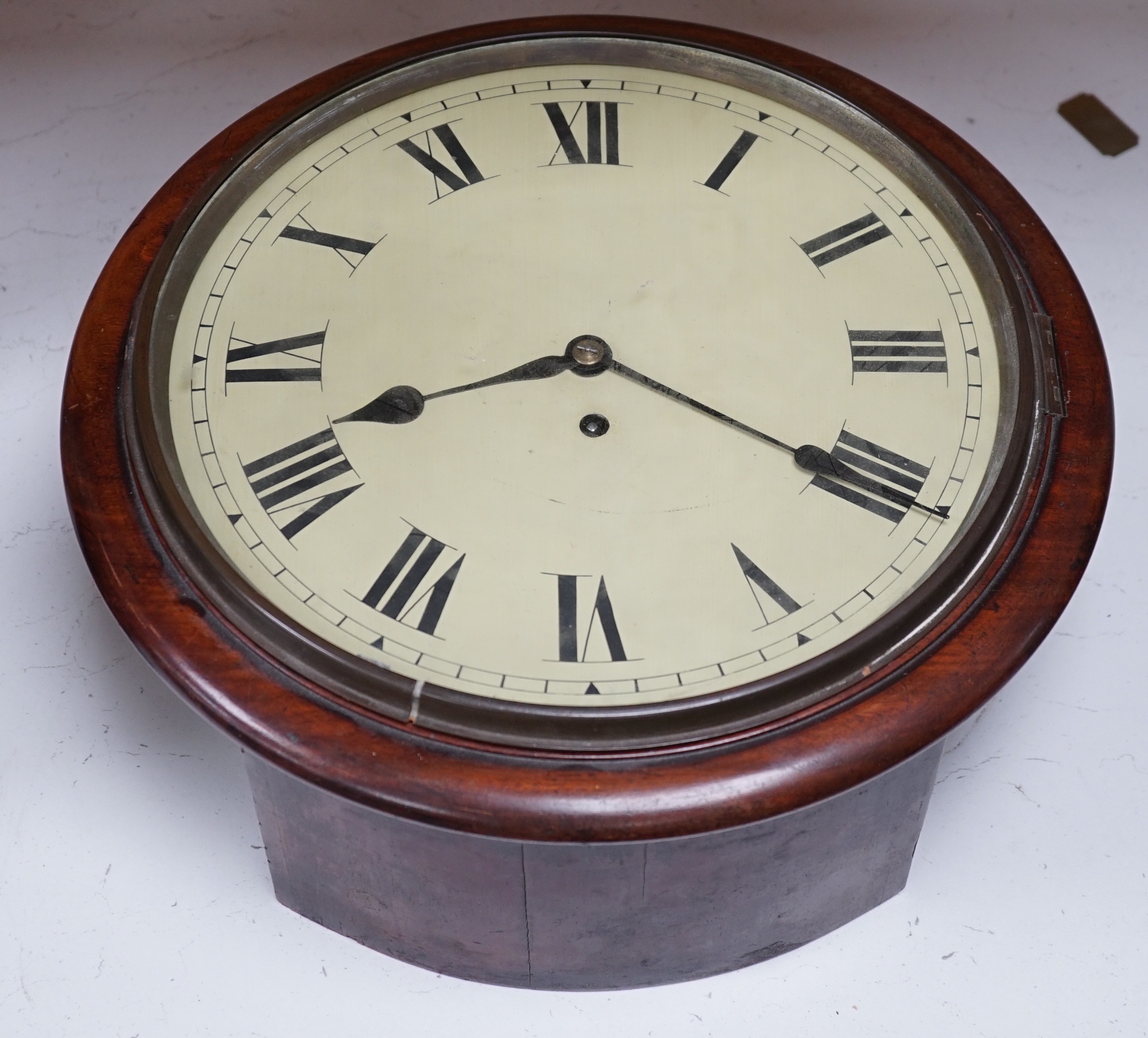 A Victorian mahogany dial timepiece, with pendulum. 36.5cm diameter